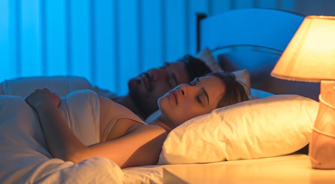 Man and woman sleeping in bed, Better Sleep Council
