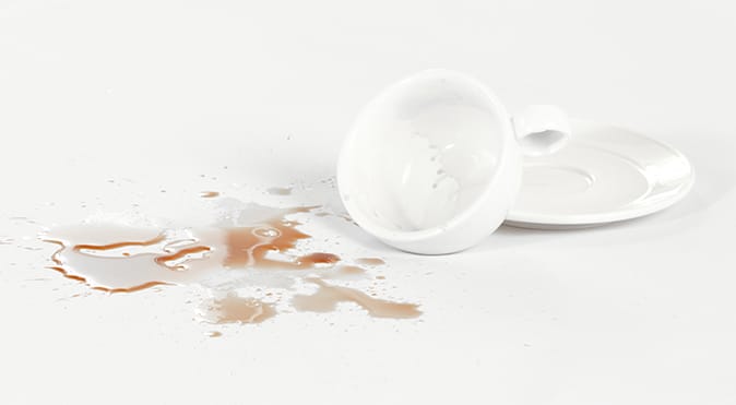 Spilt coffee on white surface, Better Sleep Council